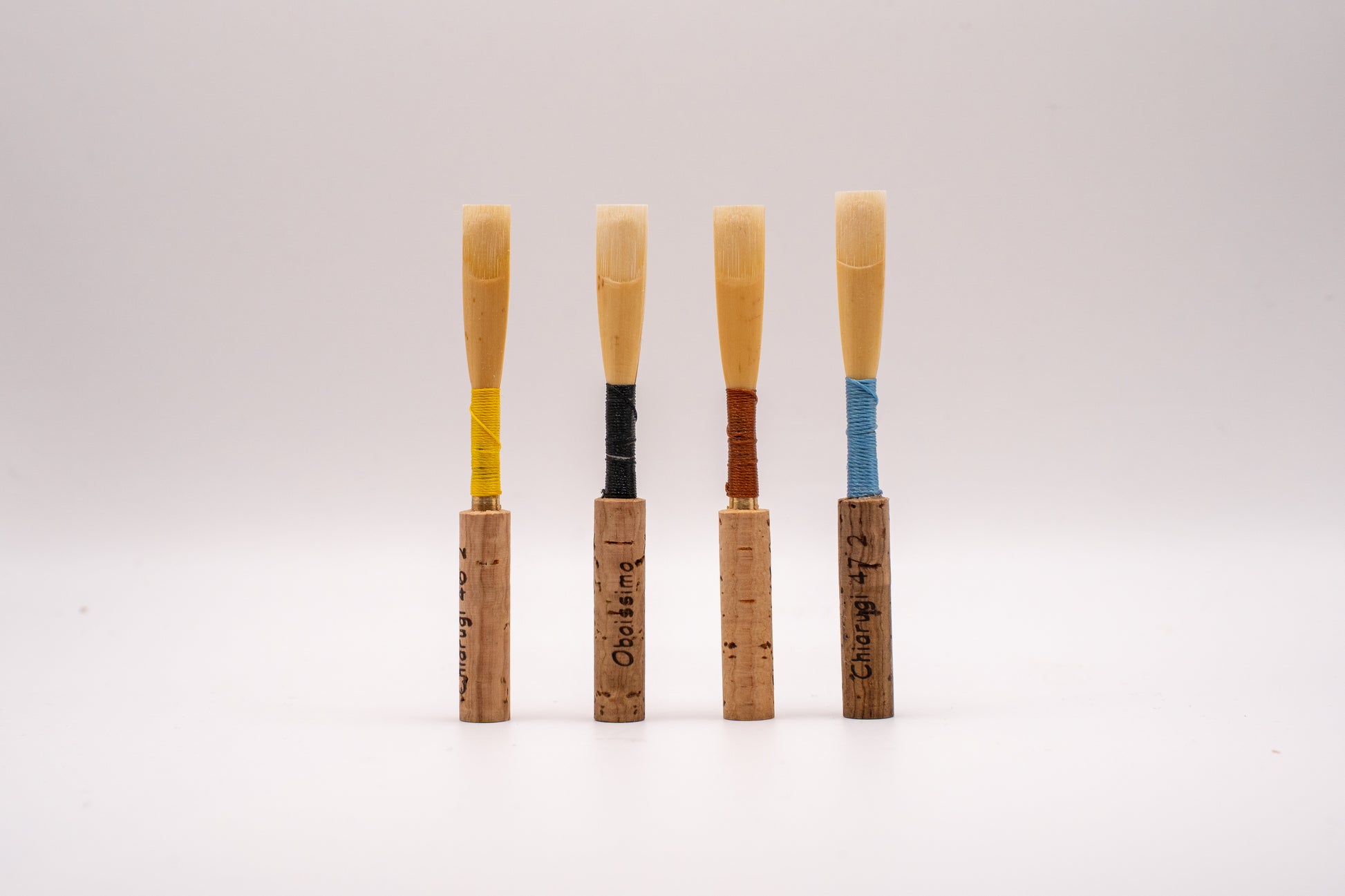 Handmade oboe reeds on customer supplied staples