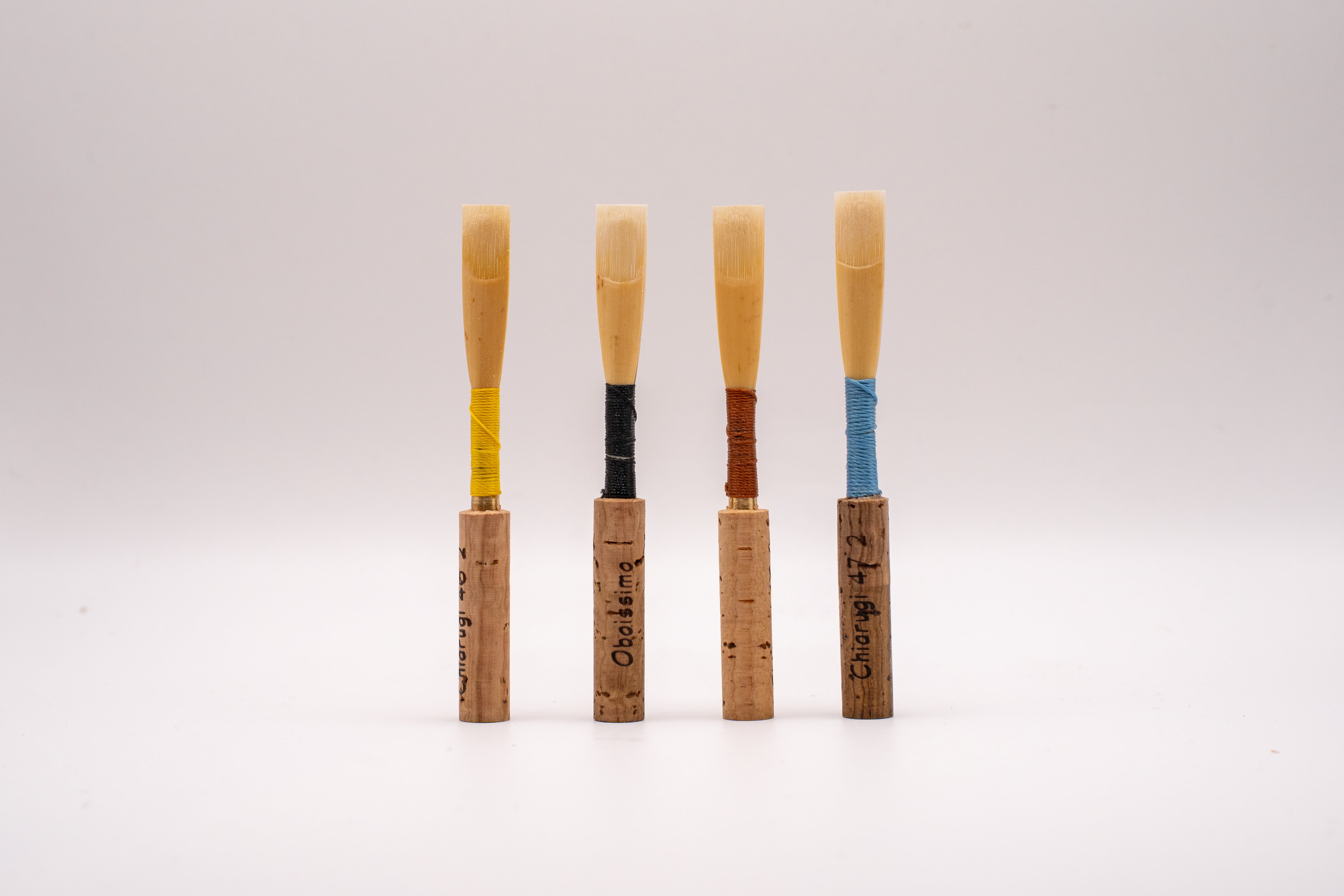 Handmade oboe reeds on customer supplied staples