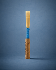 Handmade student oboe reed with blue thread